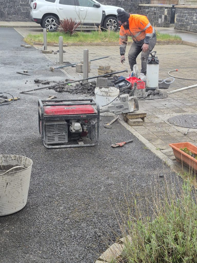 Professional installation of retractable parking bollards using industrial core drilling in Ireland.